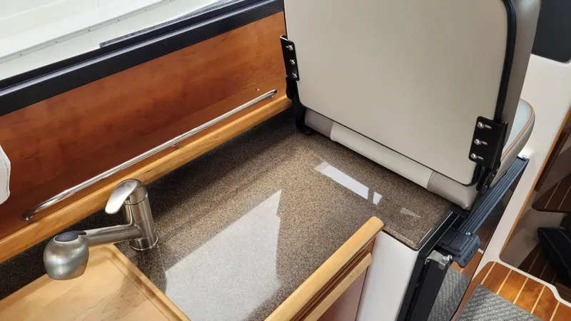 Slide: The Image of 2021 Cutwater C-28 interior with sleek countertop and modern faucet design. - 22