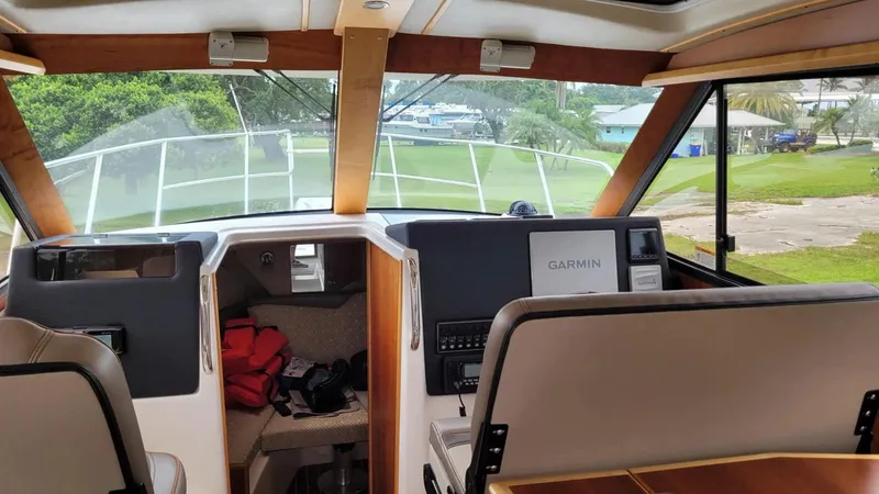 Slide: The Image of Interior view of 2021 Cutwater C-28 boat cockpit with Garmin navigation system. - 23