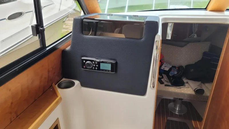 Slide: The Image of 2021 Cutwater C-28 interior with radio and cabin view. - 26