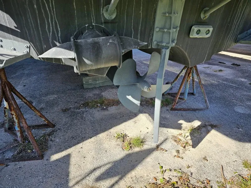 Slide: The Image of 2021 Cutwater C-28 boat propeller and rudder on dry dock. - 6