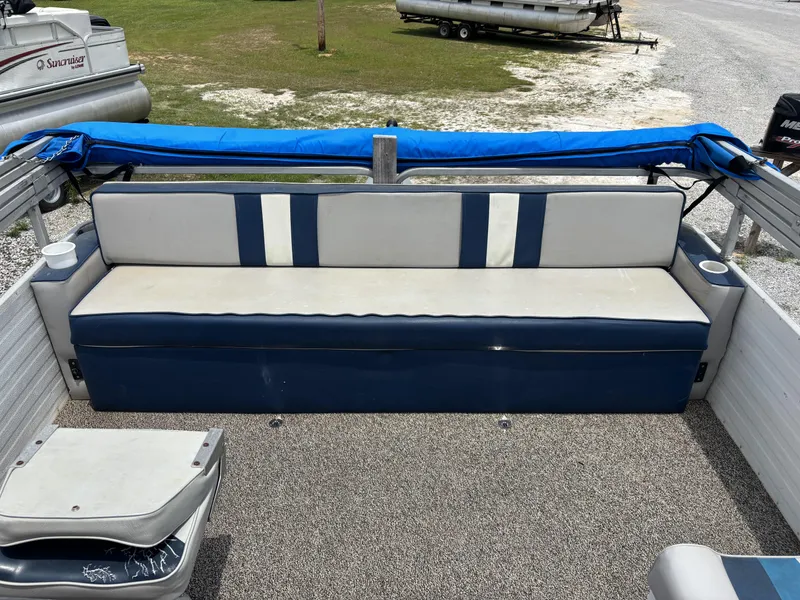 Slide: The Image of 1987 Lowe FISH AND FUN 18 boat interior with blue and white seating. - 4