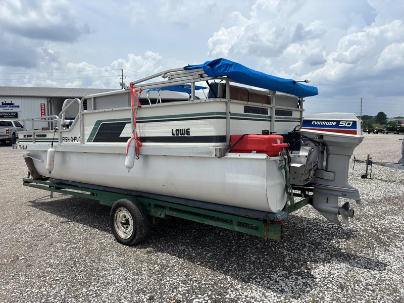 Slide: The Image of 1987 Lowe FISH AND FUN 18 pontoon boat with Evinrude 50 outboard motor on trailer. - 7