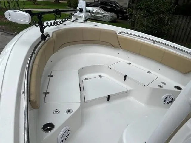 Slide: The Image of 2014 Sportsman Heritage 231 Center Console boat interior with seating and storage compartments. - 10