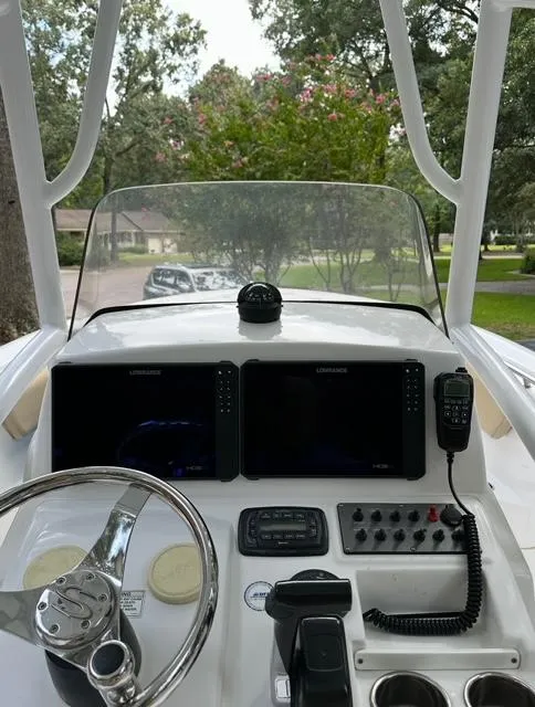 Slide: The Image of 2014 Sportsman Heritage 231 Center Console dashboard with navigation screens and controls. - 17