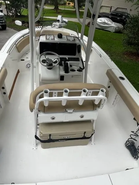 Slide: The Image of 2014 Sportsman Heritage 231 Center Console boat interior with seating and steering wheel. - 8