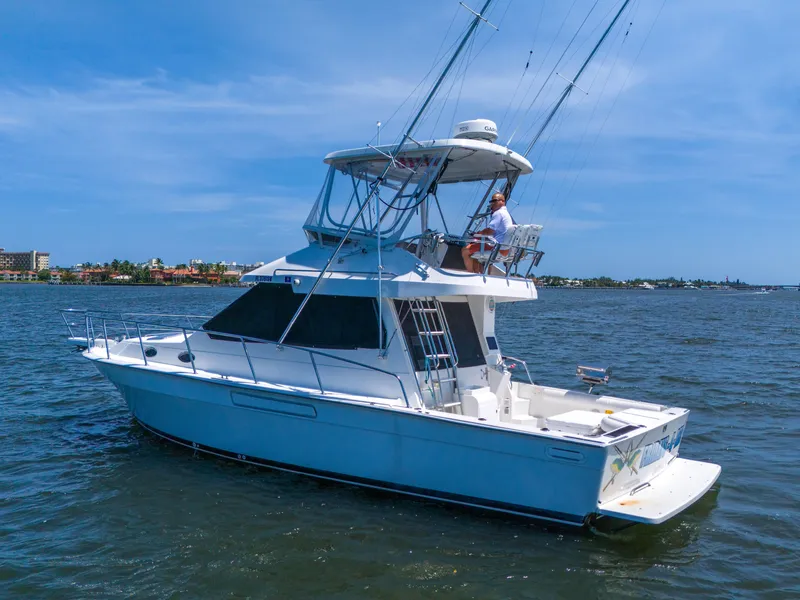 Slide: The Image of 2001 Mediterranean 38 Convertible yacht cruising on a sunny day. - 2