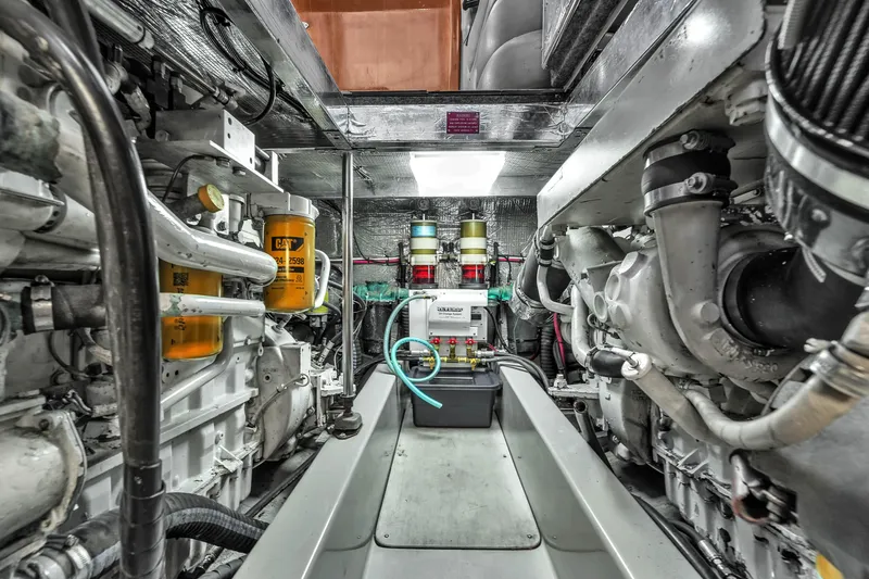 Slide: The Image of Engine room of 2001 Mediterranean 38 Convertible yacht, showcasing mechanical components and systems. - 35