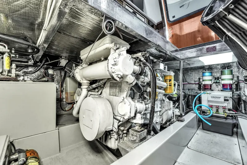 Slide: The Image of Engine room of 2001 Mediterranean 38 Convertible yacht, showcasing machinery and components. - 37