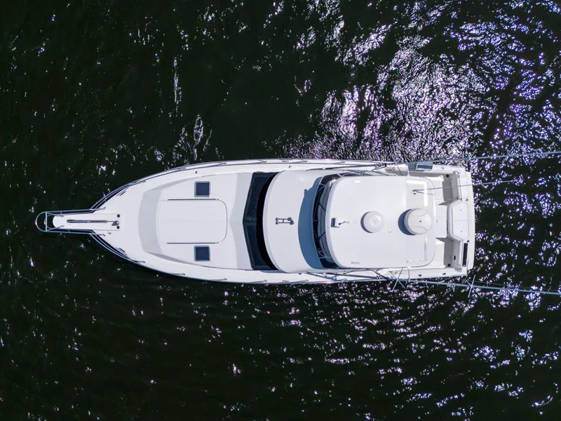 Slide: The Image of Aerial view of 2001 Mediterranean 38 Convertible yacht on dark water. - 4