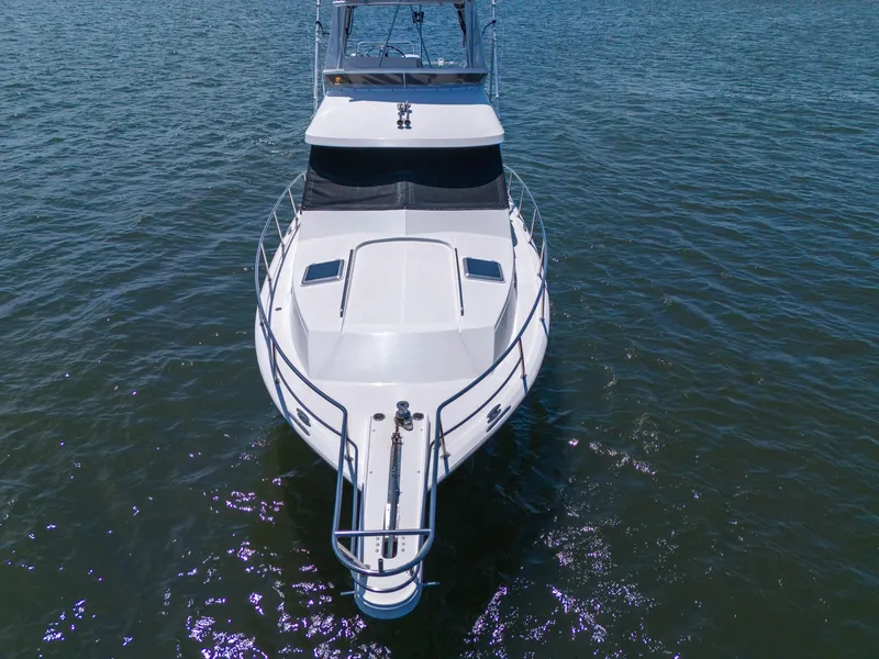 Slide: The Image of 2001 Mediterranean 38 Convertible yacht on open water, aerial view. - 43