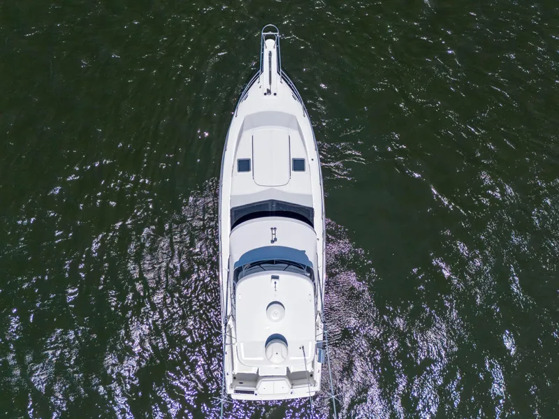 Slide: The Image of Aerial view of 2001 Mediterranean 38 Convertible yacht on shimmering water. - 47