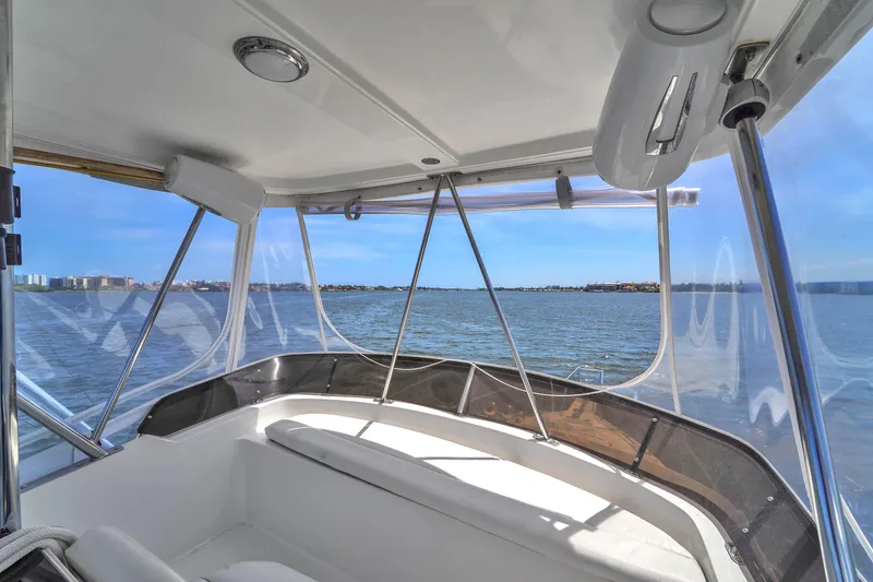 Slide: The Image of 2001 Mediterranean 38 Convertible yacht interior with ocean view through large windows. - 6