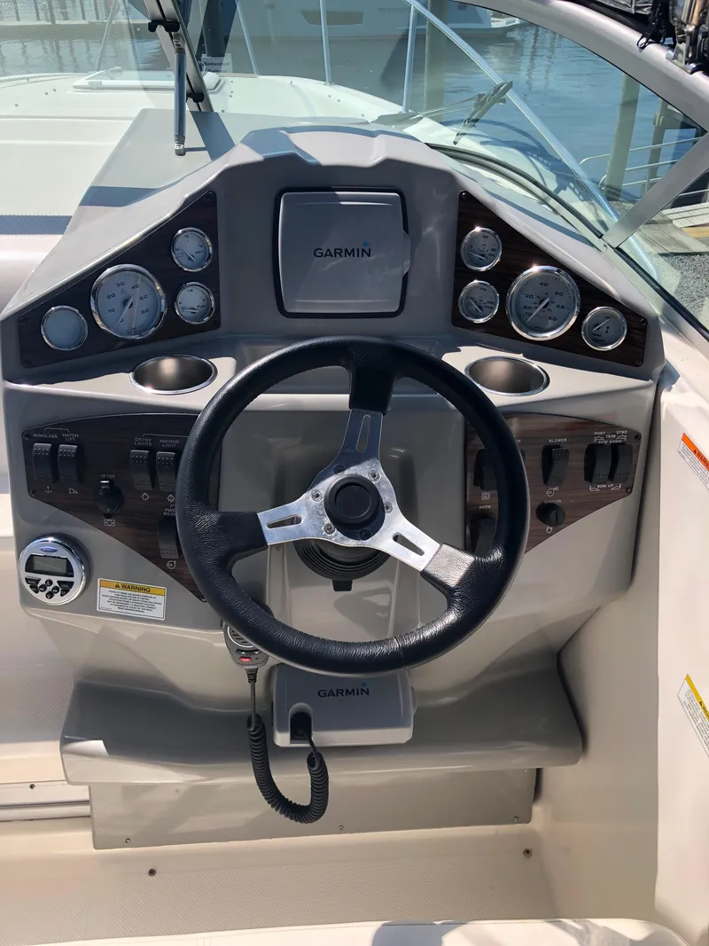 Slide: The Image of Steering console of a 2012 Bayliner 255 Cruiser with Garmin navigation system. - 15