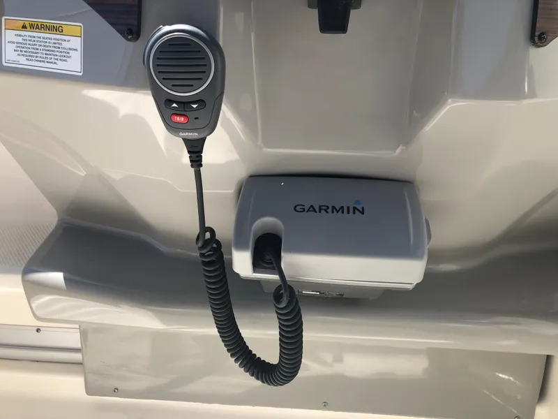 Slide: The Image of 2012 Bayliner 255 Cruiser with Garmin marine radio and microphone. - 23