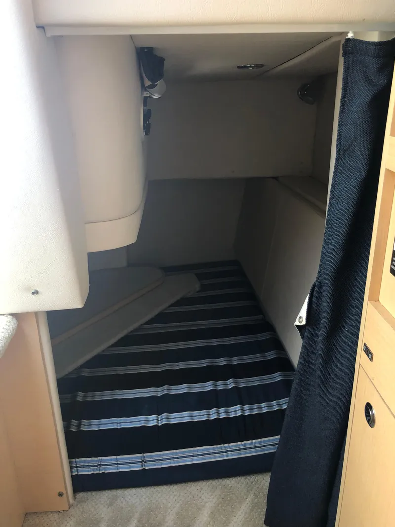 Slide: The Image of Interior cabin of 2012 Bayliner 255 Cruiser with striped flooring. - 27