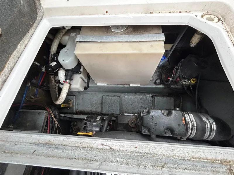 Slide: The Image of Engine compartment of a 1999 Sea Ray 270 Sundancer boat, showing mechanical components. - 21