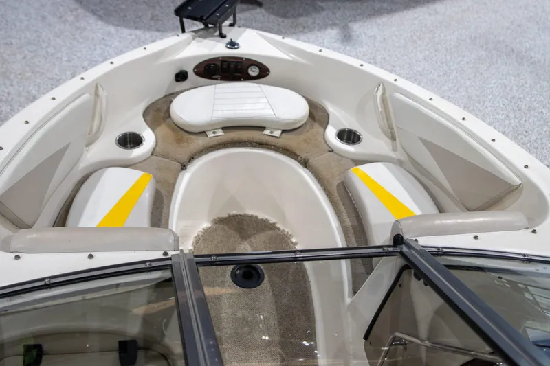 Slide: The Image of 2007 Glastron GT 205 Ski & Fish boat interior with seating and cup holders. - 10