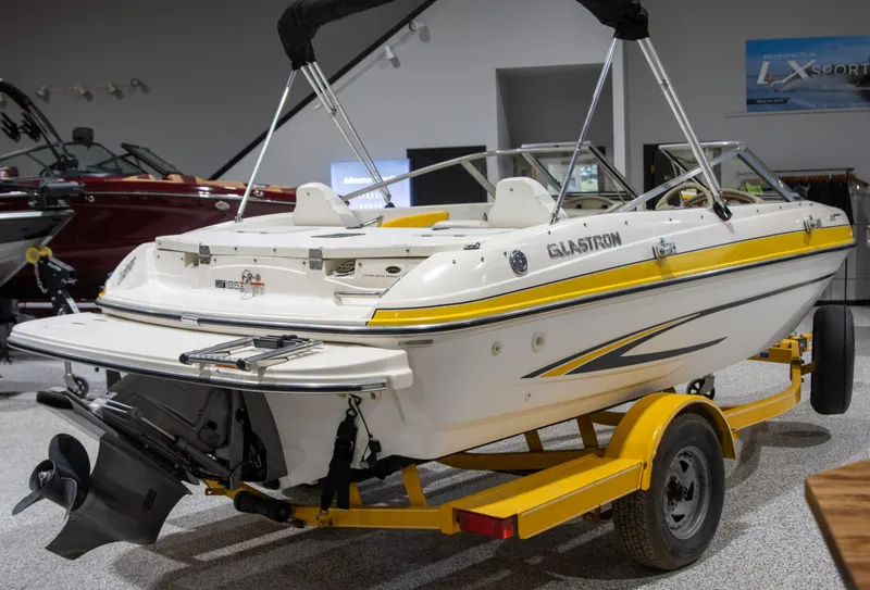 Slide: The Image of 2007 Glastron GT 205 Ski & Fish boat on trailer in showroom. - 3