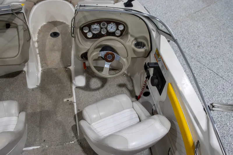 Slide: The Image of 2007 Glastron GT 205 Ski & Fish boat interior with steering wheel and dashboard controls. - 5