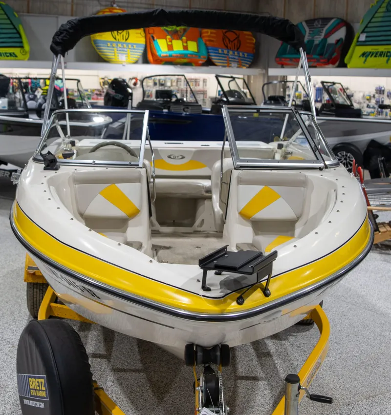 Slide: The Image of 2007 Glastron GT 205 Ski & Fish boat with yellow accents in showroom display. - 7