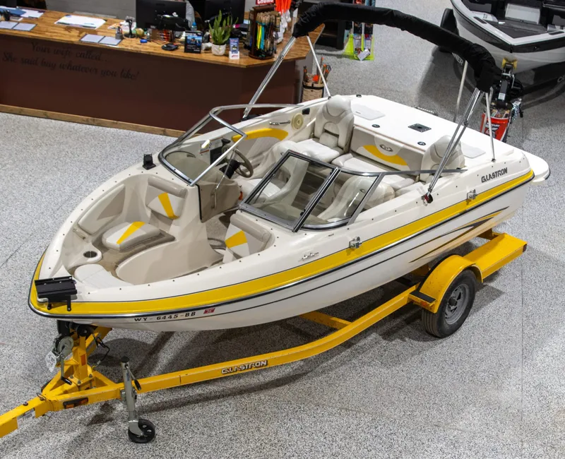Slide: The Image of 2007 Glastron GT 205 Ski & Fish boat on yellow trailer in showroom. - 8