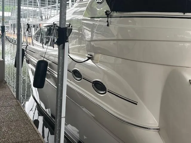 Slide: The Image of 2004 Sea Ray 390 Motor Yacht docked in marina, side view. - 10