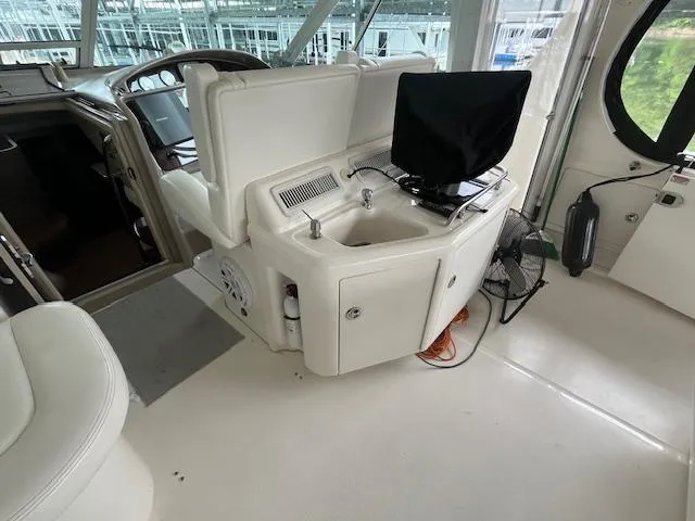 Slide: The Image of 2004 Sea Ray 390 Motor Yacht interior with sink and covered monitor. - 16