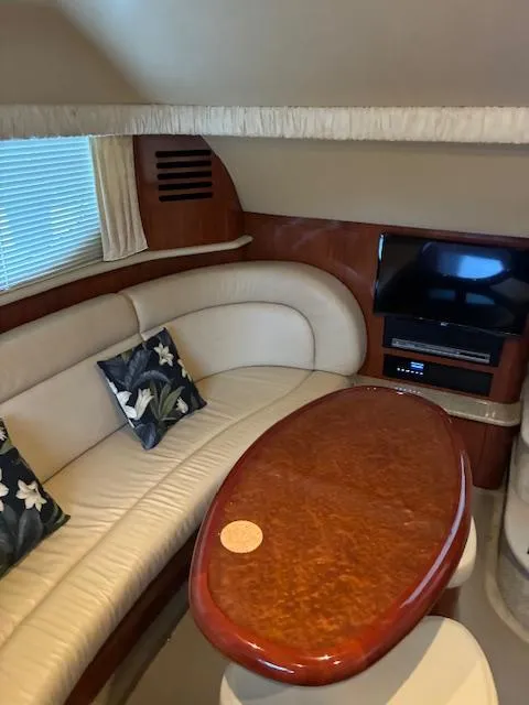 Slide: The Image of Luxurious interior of a 2004 Sea Ray 390 Motor Yacht with elegant seating and entertainment area. - 19