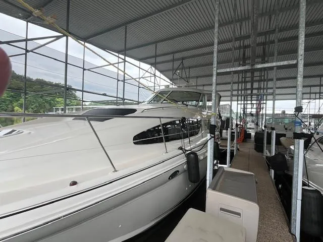 Slide: The Image of 2004 Sea Ray 390 Motor Yacht docked in a covered marina. - 2