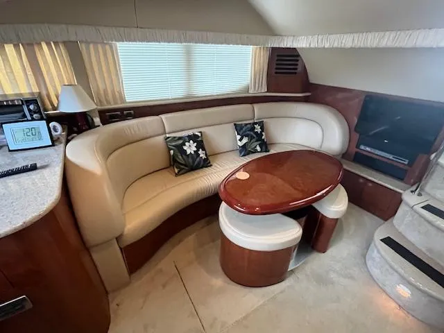 Slide: The Image of Luxurious interior of 2004 Sea Ray 390 Motor Yacht with elegant seating and table. - 22