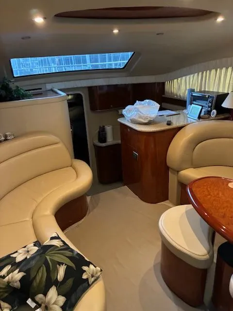 Slide: The Image of Luxurious interior of a 2004 Sea Ray 390 Motor Yacht with elegant seating and wood finishes. - 25