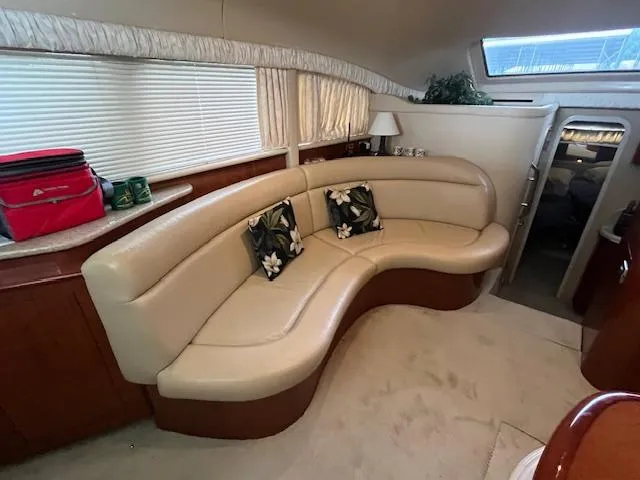 Slide: The Image of Luxurious interior of 2004 Sea Ray 390 Motor Yacht with curved leather seating. - 28