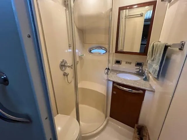 Slide: The Image of Bathroom interior of 2004 Sea Ray 390 Motor Yacht with shower, sink, and mirror. - 34
