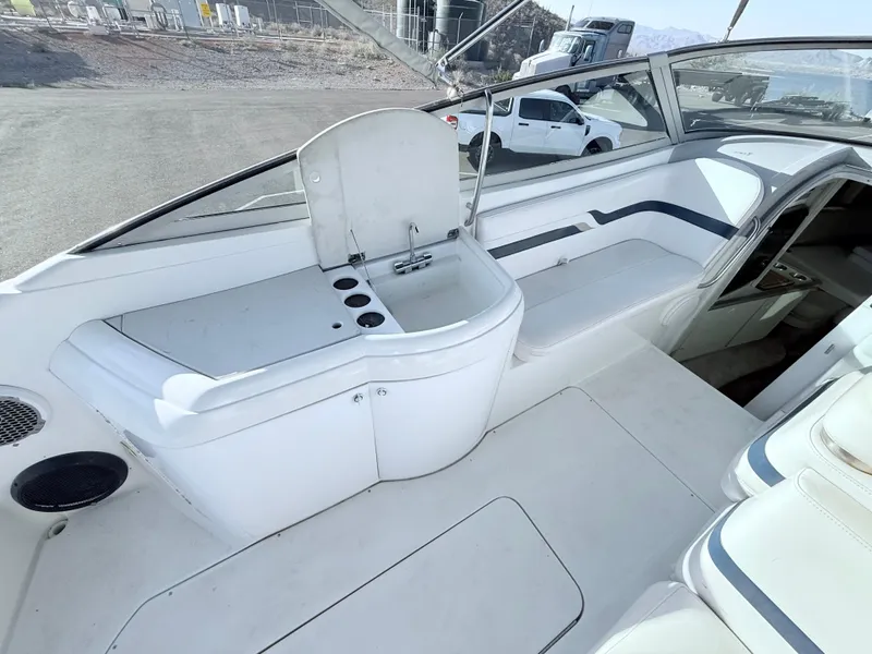 Slide: The Image of 2000 Formula 330 Sun Sport boat interior with sink and seating area. - 10