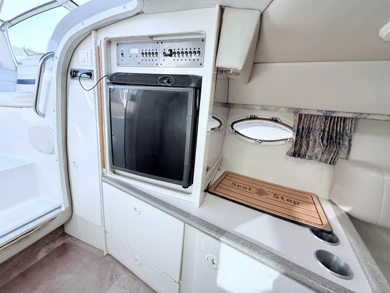 Slide: The Image of 2000 Formula 330 Sun Sport interior with kitchenette and storage cabinets. - 18