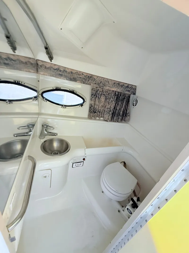 Slide: The Image of Interior of 2000 Formula 330 Sun Sport boat bathroom with sink and toilet. - 19
