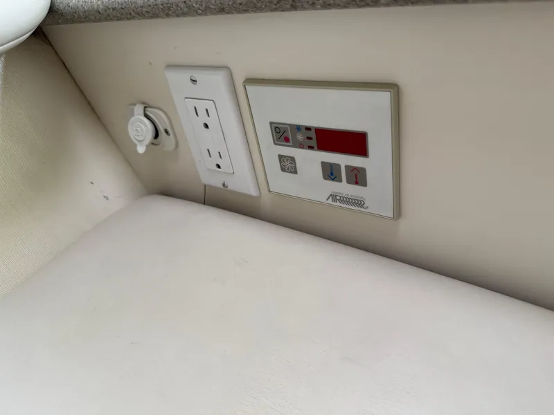 Slide: The Image of Power outlet and control panel on a 2000 Formula 330 Sun Sport boat. - 20