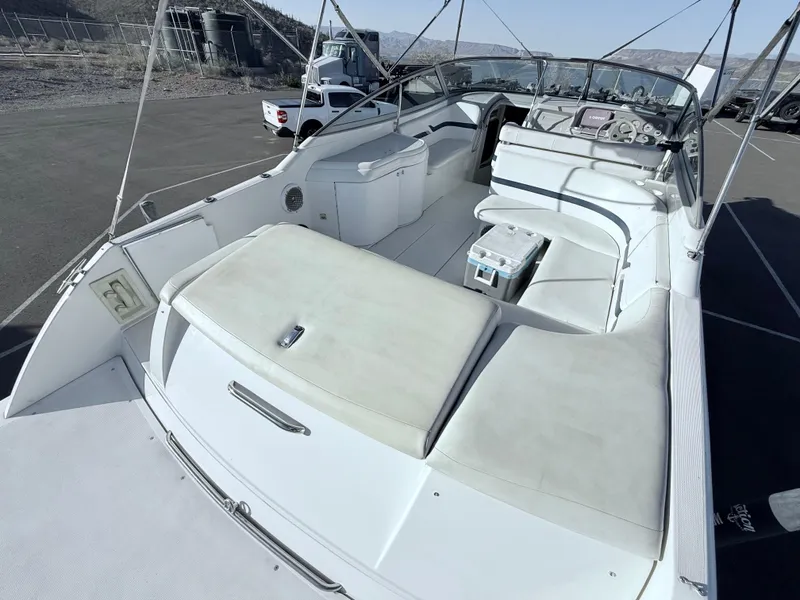 Slide: The Image of 2000 Formula 330 Sun Sport boat with spacious seating and sleek design. - 7