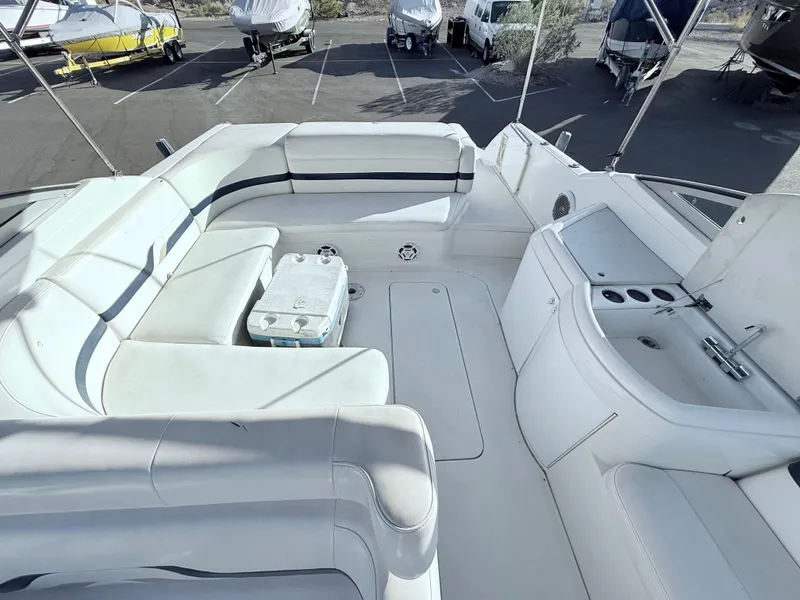Slide: The Image of 2000 Formula 330 Sun Sport boat interior with white seating and built-in amenities. - 8