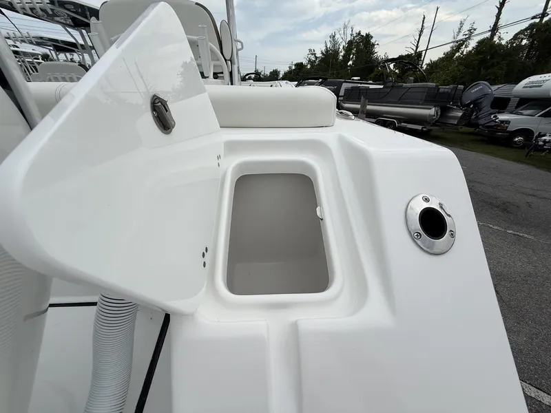 Slide: The Image of Open storage compartment on 2025 Tidewater 272 LXF boat, showcasing sleek design. - 3