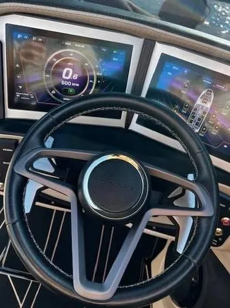 Slide: The Image of 2021 Centurion Ri265 dashboard with dual digital displays and steering wheel. - 12