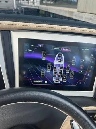 Slide: The Image of 2021 Centurion Ri265 dashboard display with control panel interface. - 14