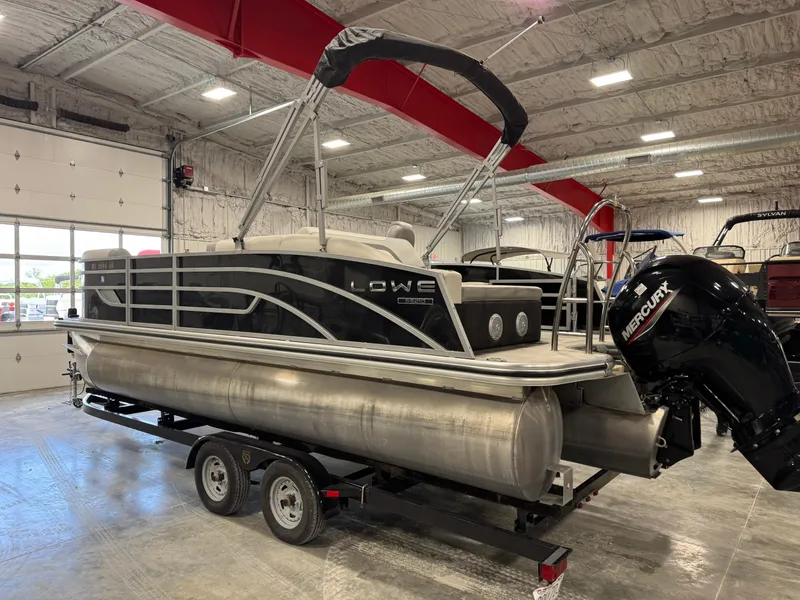Slide: The Image of 2022 Lowe 210 SS pontoon boat on trailer in indoor showroom. - 4