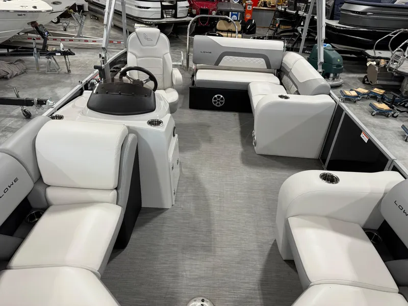Slide: The Image of 2022 Lowe 210 SS pontoon boat interior with spacious seating and modern design. - 7