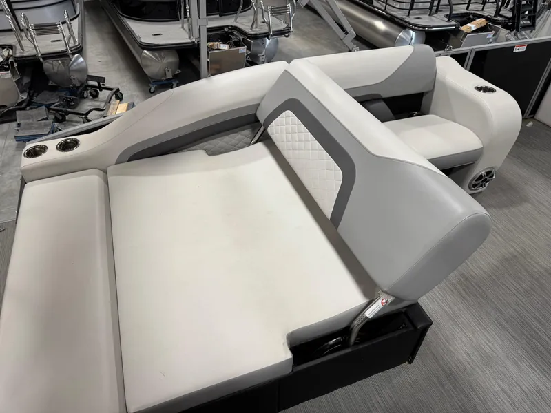 Slide: The Image of 2022 Lowe 210 SS boat interior with gray seating and cup holders. - 8