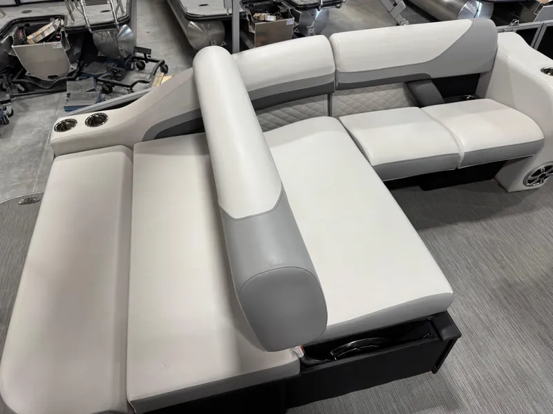 Slide: The Image of 2022 Lowe 210 SS boat interior with white and gray seating arrangement. - 9