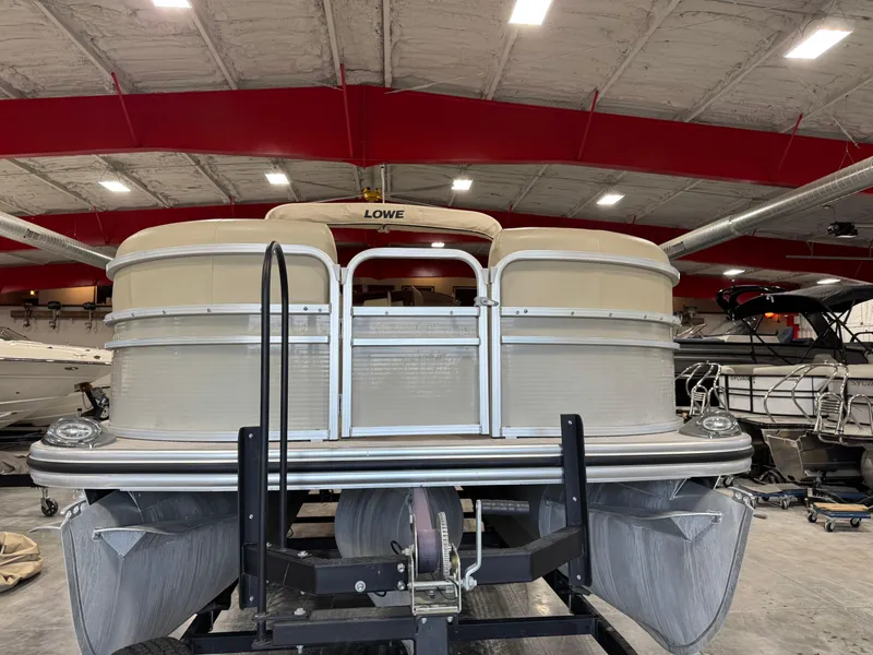 Slide: The Image of 2015 Lowe 210 SS pontoon boat in indoor storage facility. - 7