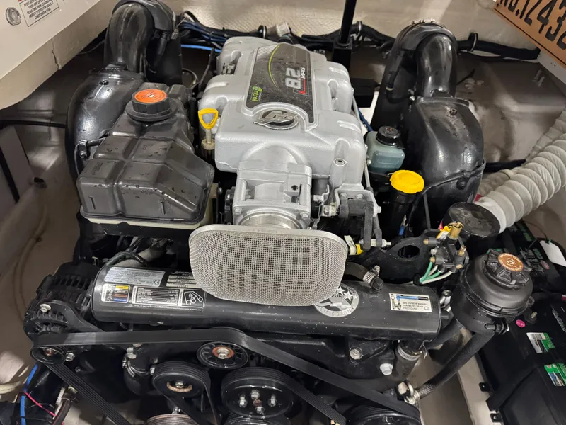 Slide: The Image of 2012 Rinker 296 Captiva Bowrider engine, showcasing detailed components and layout. - 14