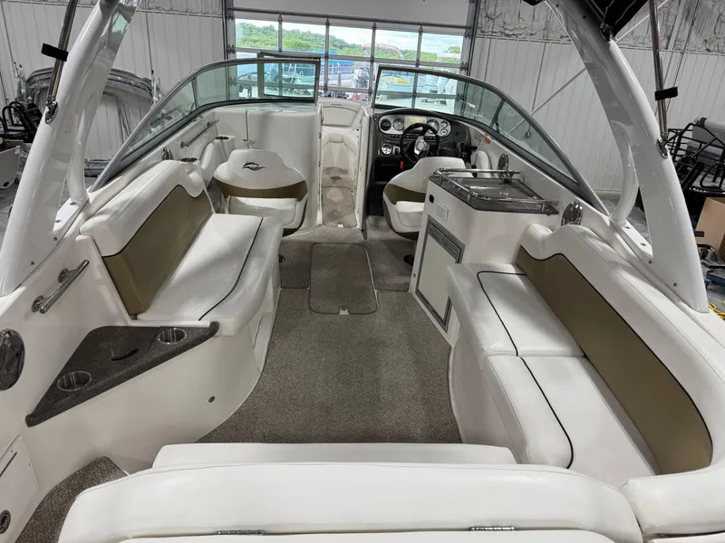 Slide: The Image of 2012 Rinker 296 Captiva Bowrider interior with spacious seating and modern amenities. - 6