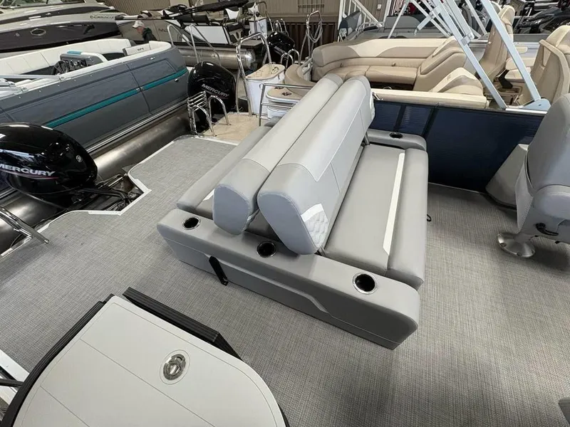 Slide: The Image of 2025 Crest Classic 220 SLSC Tritoon interior with gray seating and cup holders. - 8